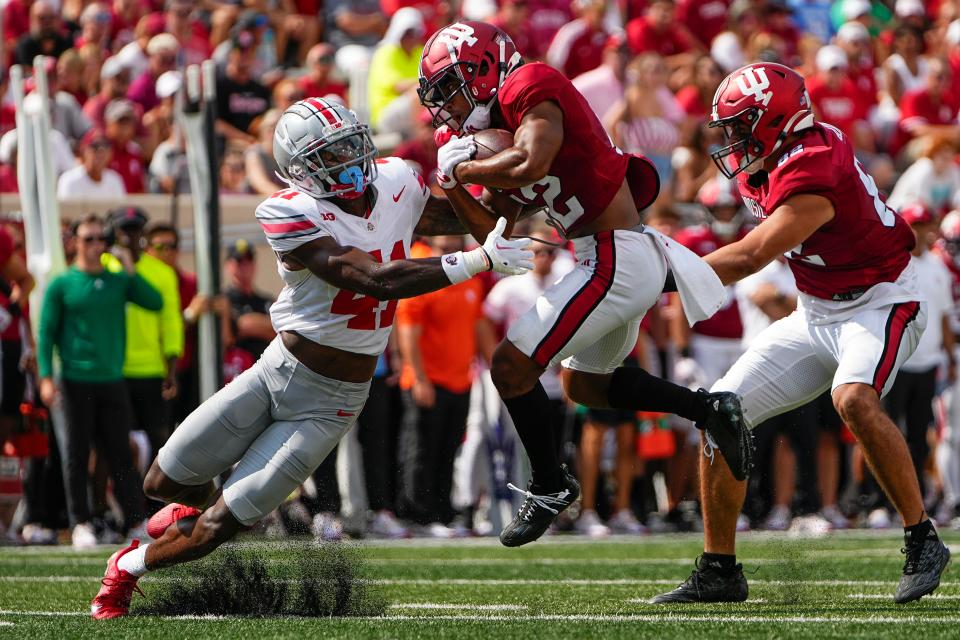 Ohio State's Josh Proctor, left, was the Buckeyes third safety on Saturday and helped hold Indiana to 153 yards of offense.
