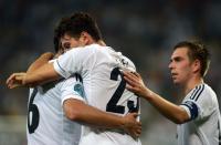 German forward Mario Gomez (C) is congratulated by German midfielder Sami Khedira (L) and German defender Philipp Lahm after scoring a goal during the Euro 2012 championships football match Germany vs Portugal on June 9, 2012 at the Arena Lviv. AFP PHOTO / PATRIK STOLLARZPATRIK STOLLARZ/AFP/GettyImages