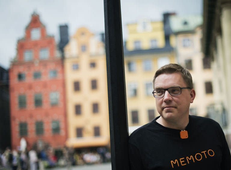 Co-founder and CEO of Swedish company Memoto, Martin Kaellstroem, wearing with a clip on his shirt the life-logging Memoto camera in Stockholm's old town on August 29, 2013. When Martin Kaellstroem was a young adult, he lost both his parents to cancer. It became a spur for him to seize the day, as a person and an entrepreneur