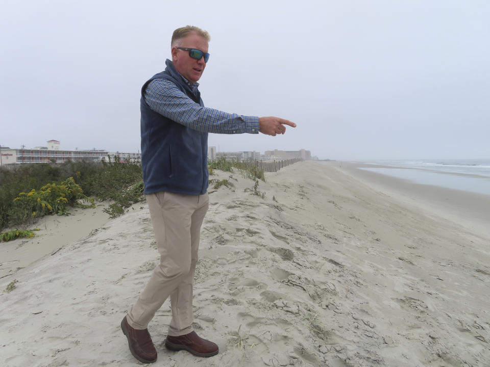 Patrick Rosenello, mayor of North Wildwood, N.J., points out erosion along his city's coastline on Oct. 25, 2022. On Jan. 4, 2023, the city asked a judge to force the state environmental protection department to pay it $21 million to cover the cost of trucking in sand over the past decade. (AP Photo/Wayne Parry)