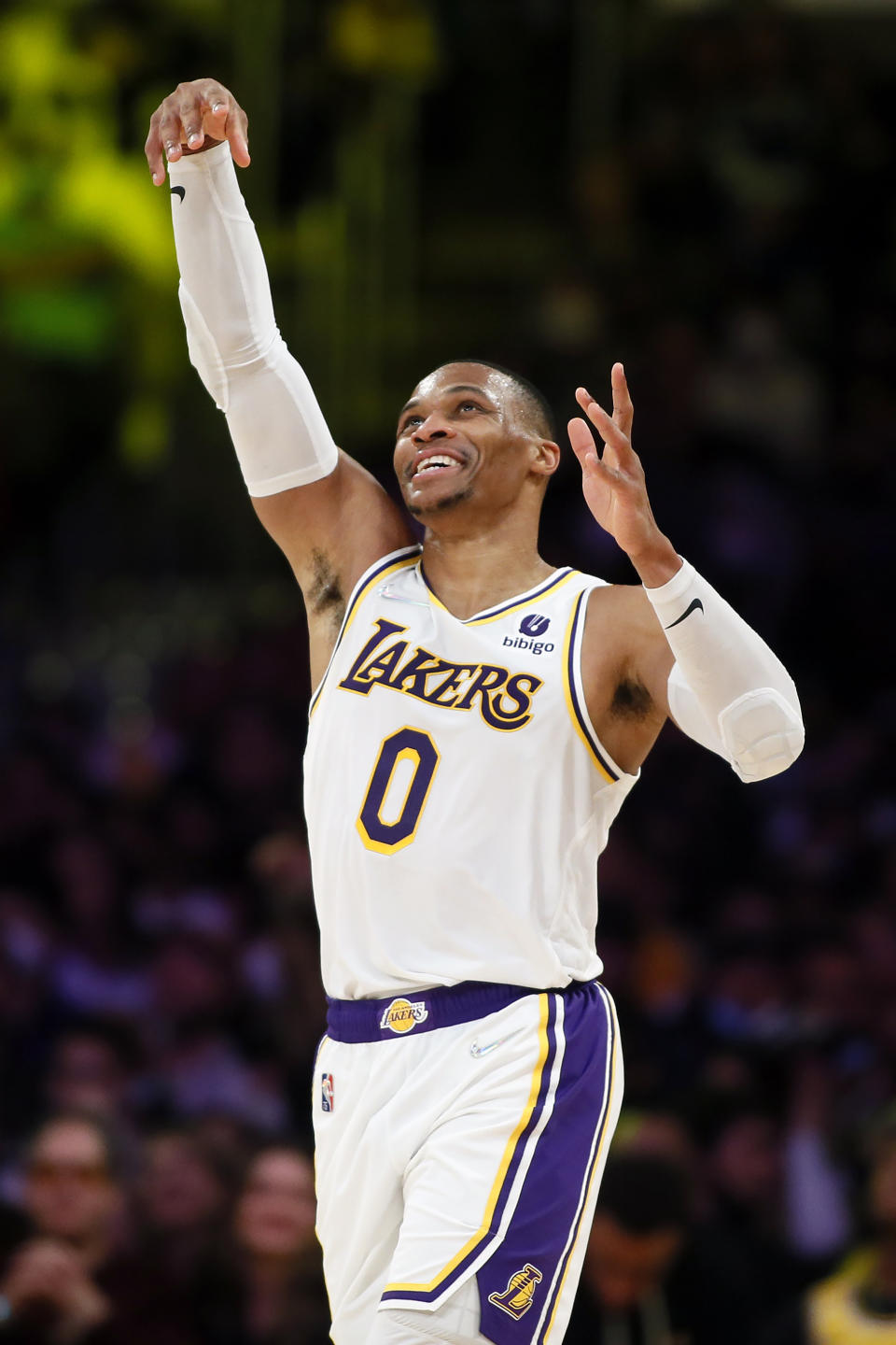 Los Angeles Lakers guard Russell Westbrook celebrates watching a video replay after making a basket and collecting a foul against the Detroit Pistons during the second half of an NBA basketball game Sunday, Nov. 28, 2021, in Los Angeles. (AP Photo/Alex Gallardo)