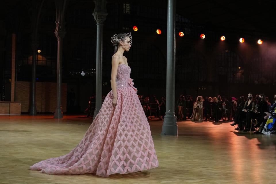 A model wears a creation for the Elie Saab Spring-Summer 2022 Haute Couture fashion collection, in Paris, Wednesday, Jan. 26, 2022. (AP Photo/Francois Mori)