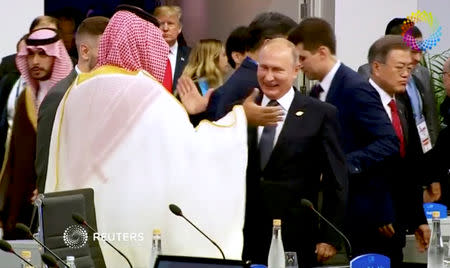 Saudi Arabia's Crown Prince Mohammed bin Salman greets Russia's President Vladimir Putin during the opening of the G20 leaders summit in Buenos Aires, Argentina November 30, 2018 in this picture taken from video. Reuters TV Summit Pool via REUTERS