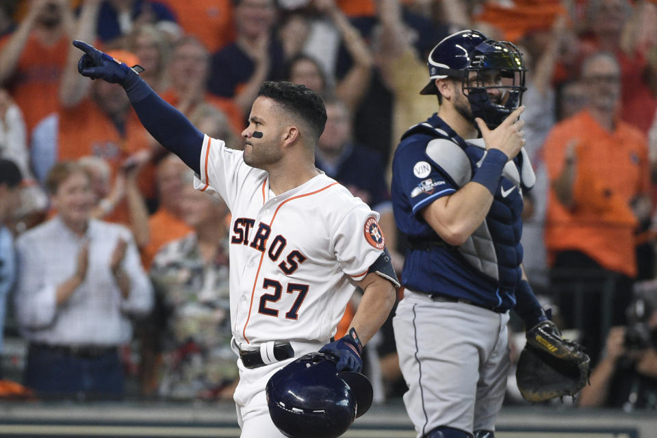 Houston Astros' Jose Altuve (27) celebrates after hitting a two-run home rung against the Tampa Bay Rays in the fifth inning during Game 1 in baseball's American League Division Series in Houston, Friday, Oct. 4, 2019. (AP Photo/Michael Wyke)