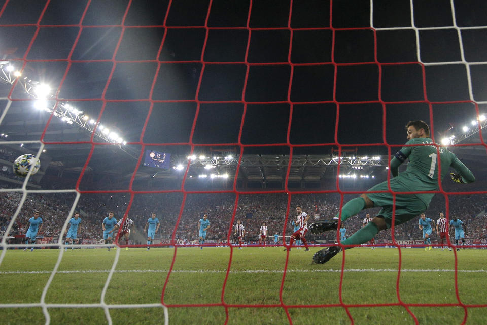 Mathieu Valbuena equalises from the spot for Olympiacos. (Photo by Dean Mouhtaropoulos/Getty Images)