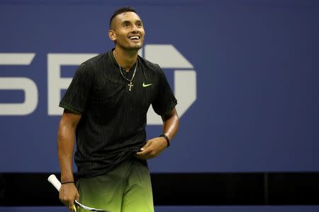 Sep 3, 2016; New York, NY, USA; Nick Kyrgios of Australia smiles on the court after winning a point against Ilya Marchenko of Ukraine (not pictured) on day six of the 2016 U.S. Open tennis tournament at USTA Billie Jean King National Tennis Center. Mandatory Credit: Geoff Burke-USA TODAY Sports