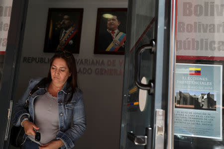 A woman walks out of the Venezuelan Consulate in Madrid, Spain, May 16, 2018. REUTERS/Susana Vera