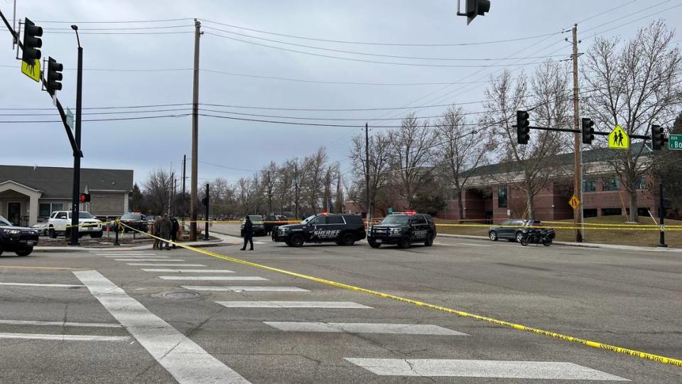 Boise police officers at the scene of an officer-involved shooting at Boise Avenue and Apple Street on March 8.