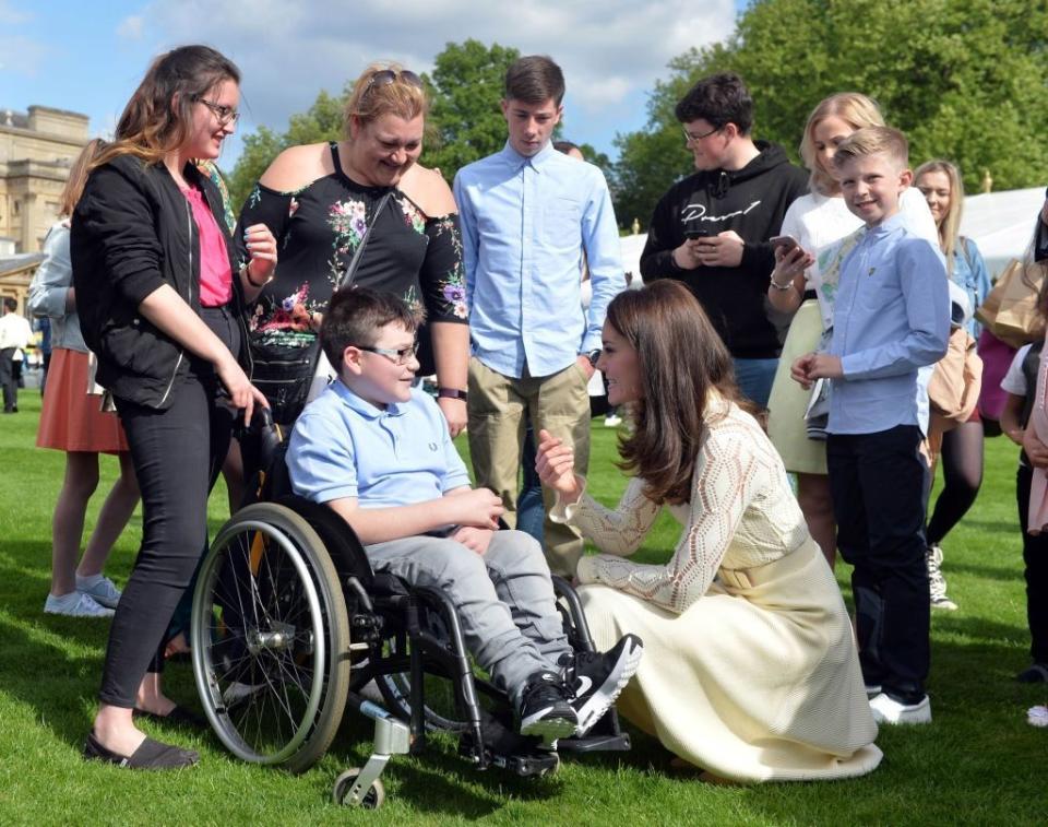 Kate Middleton talks to tea party guests