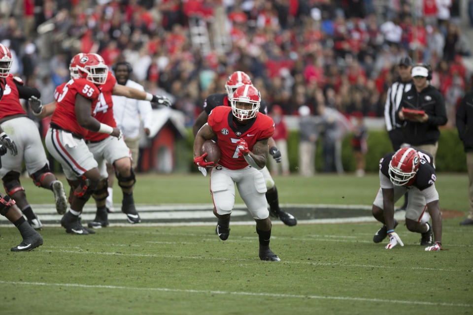 Georgia running back D'Andre Swift (7) runs the ball in the first half of the NCAA football spring G-Day game at the University of Georgia in Athens, Ga., on Saturday, April 20, 2019. (Jenn Finch/Athens Banner-Herald via AP)