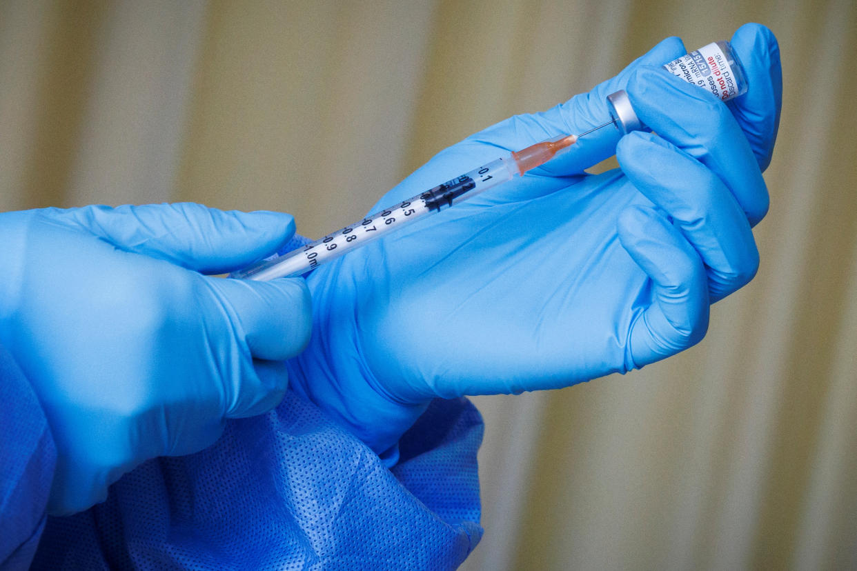 A nurse prepares a vaccine shot as the German embassy begins its roll out of BioNTech COVID-19 vaccines for German expatriates at a Beijing United Family hospital in Beijing, China January 5, 2023. REUTERS/Thomas Peter