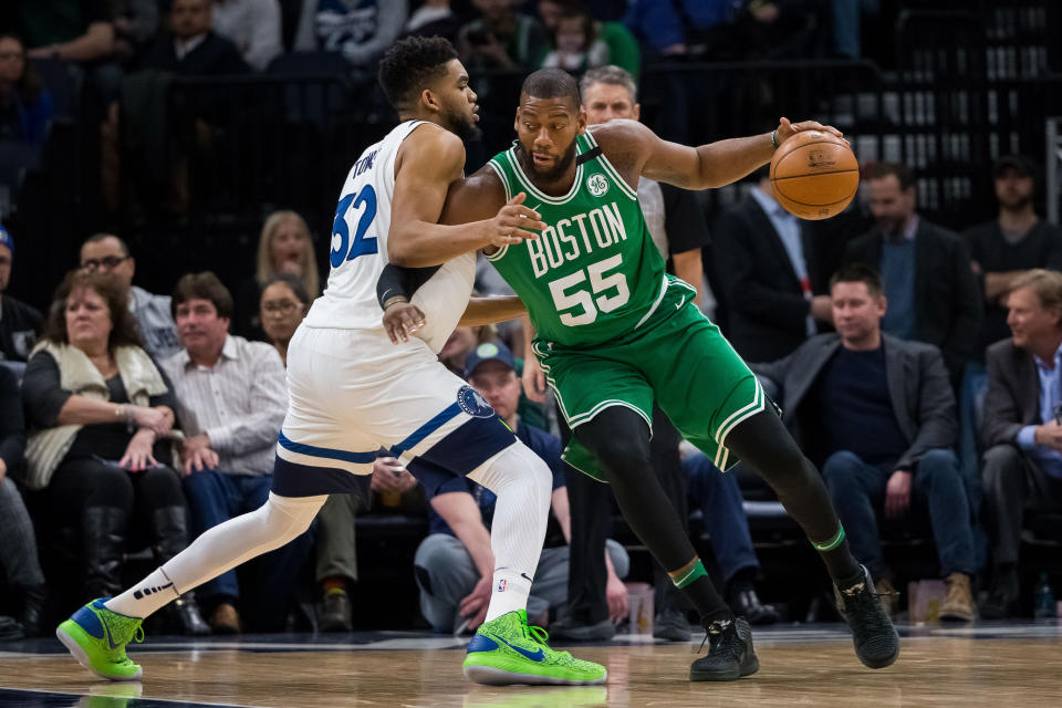 Mar 8, 2018; Minneapolis, MN, USA; Boston Celtics center Greg Monroe (55) dribbles in the second quarter against <a class="link " href="https://sports.yahoo.com/nba/teams/minnesota/" data-i13n="sec:content-canvas;subsec:anchor_text;elm:context_link" data-ylk="slk:Minnesota Timberwolves;sec:content-canvas;subsec:anchor_text;elm:context_link;itc:0">Minnesota Timberwolves</a> center <a class="link " href="https://sports.yahoo.com/nba/players/5432" data-i13n="sec:content-canvas;subsec:anchor_text;elm:context_link" data-ylk="slk:Karl-Anthony Towns;sec:content-canvas;subsec:anchor_text;elm:context_link;itc:0">Karl-Anthony Towns</a> (32) at Target Center. Brad Rempel-USA TODAY Sports