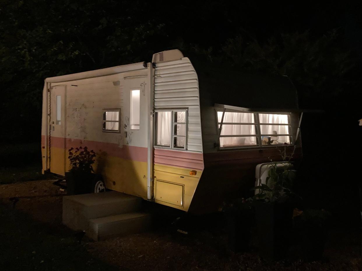 A Dolly Parton-themed RV at night