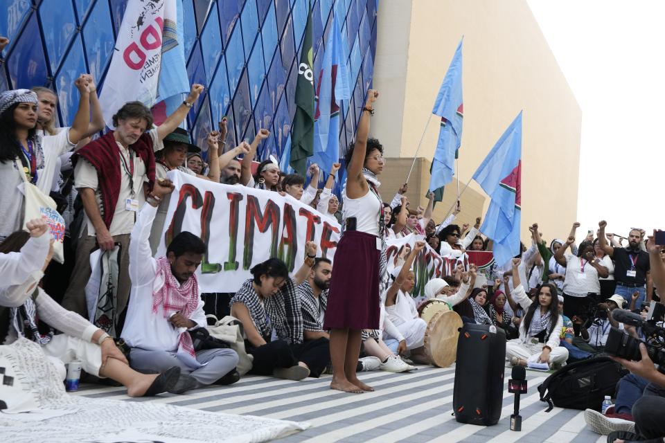 Gina Marcela Cortes Valderrama leads a protest against the Israel-Hamas war at the COP28 U.N. Climate Summit, Sunday, Dec. 3, 2023, in Dubai, United Arab Emirates. (AP Photo/Peter Dejong)