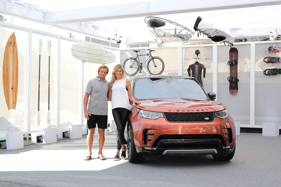 Surfer, Laird Hamilton and champion volleyball player and fitness leader Gabby Reece, with the Land Rover Discovery SUV at the vehicle's North American debut in November 11, 2016 in Venice, California.