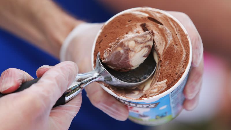 Organizer Matthew Parks and other volunteers hand out free ice cream cones at his house in Orem on Tuesday, April 14, 2015.