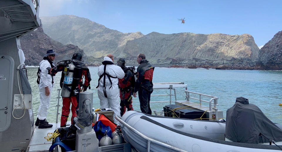 Police divers prepare to search the waters near White Island off the coast of Whakatane, New Zealand.