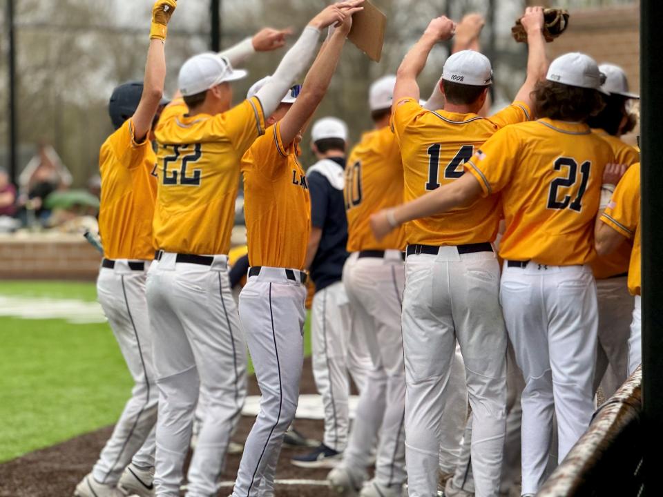 The Lancaster baseball team celebrate during a recent game against Groveport. The Golden Gales lost their season opener but have since won eight in a row, including five straight Ohio Capital Conference-Buckeye Division wins.