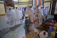 Muslim women perform an evening prayer called 'tarawih' during the first evening of the holy fasting month of Ramadan, at Al Mashun Great Mosque in Medan, North Sumatra, Indonesia, Monday, April 12, 2021. During Ramadan, the holiest month in Islamic calendar, Muslims refrain from eating, drinking, smoking and sex from dawn to dusk. (AP Photo/ Binsar Bakkara)