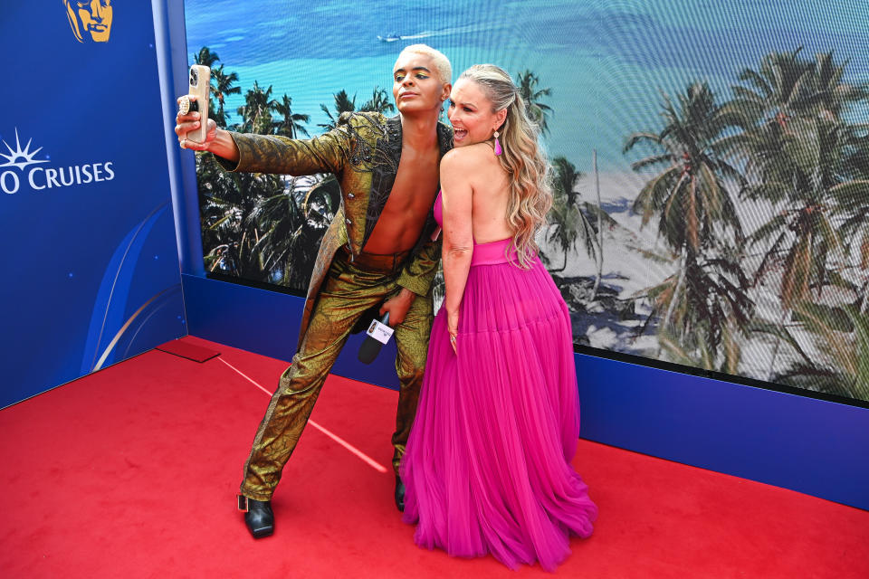 LONDON, ENGLAND - MAY 12: (L-R) Layton Williams takes a selfie with Mel Schilling on the red carpet at the 2024 BAFTA Television Awards with P&O Cruises at The Royal Festival Hall on May 12, 2024 in London, England. P&O Cruises celebrates its second year as headline sponsor of the 2024 BAFTA Television Awards. During the ceremony the winner of the P&O Cruises Memorable Moment Award, which is the only award voted for by the public, was announced and honours the impact of television in the UK and its power to entertain, inform and bring the nation together. (Photo by James D. Morgan/Getty Images for P&O Cruises)