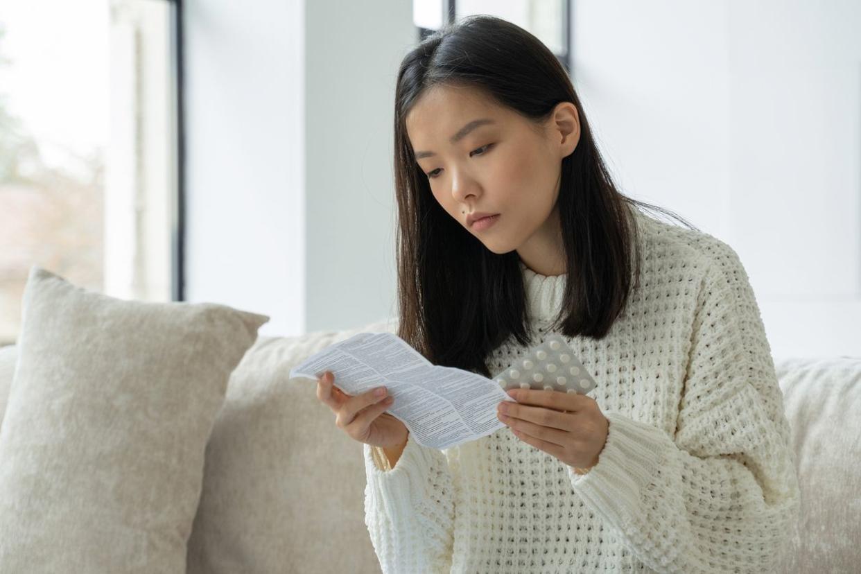 woman  reads instructions