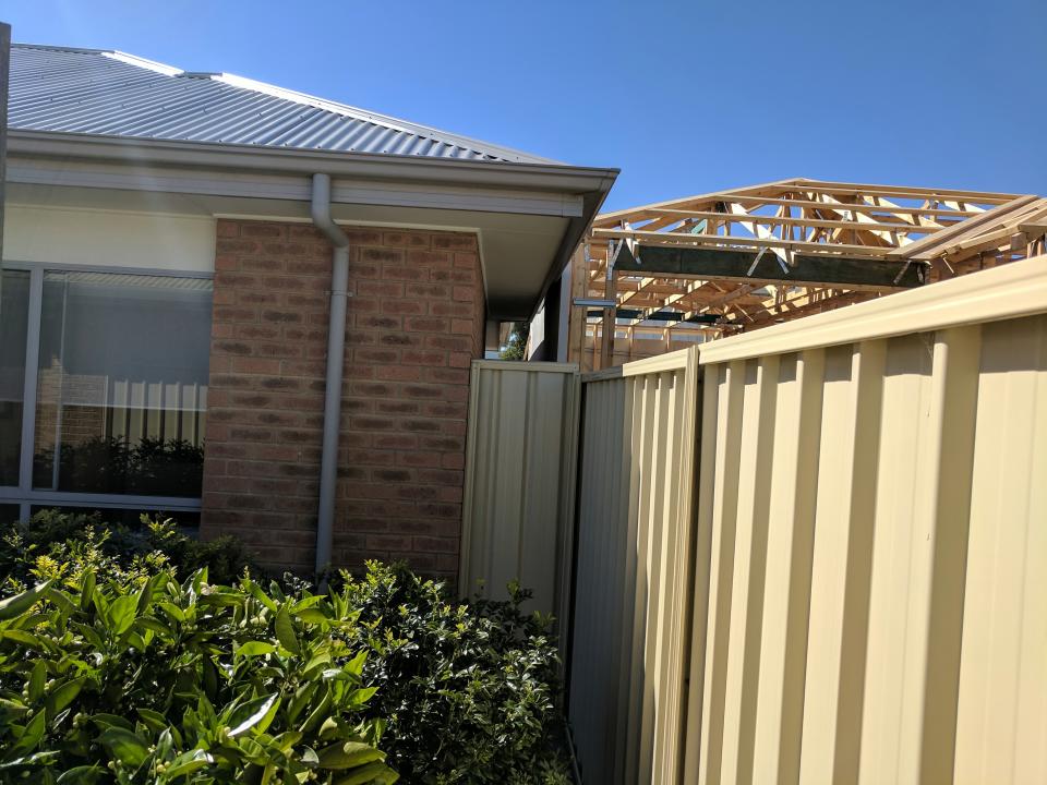 Adelaide home with gutter squashed and light blocked by new development.