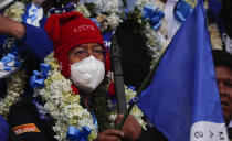 Bolivian presidential candidate for the Movement Towards Socialism Party, MAS, Luis Arce, attends his closing campaign rally for the upcoming Oct. 18, presidential elections, in El Alto, Bolivia, Wednesday, Oct. 14, 2020. (AP Photo/Juan Karita)