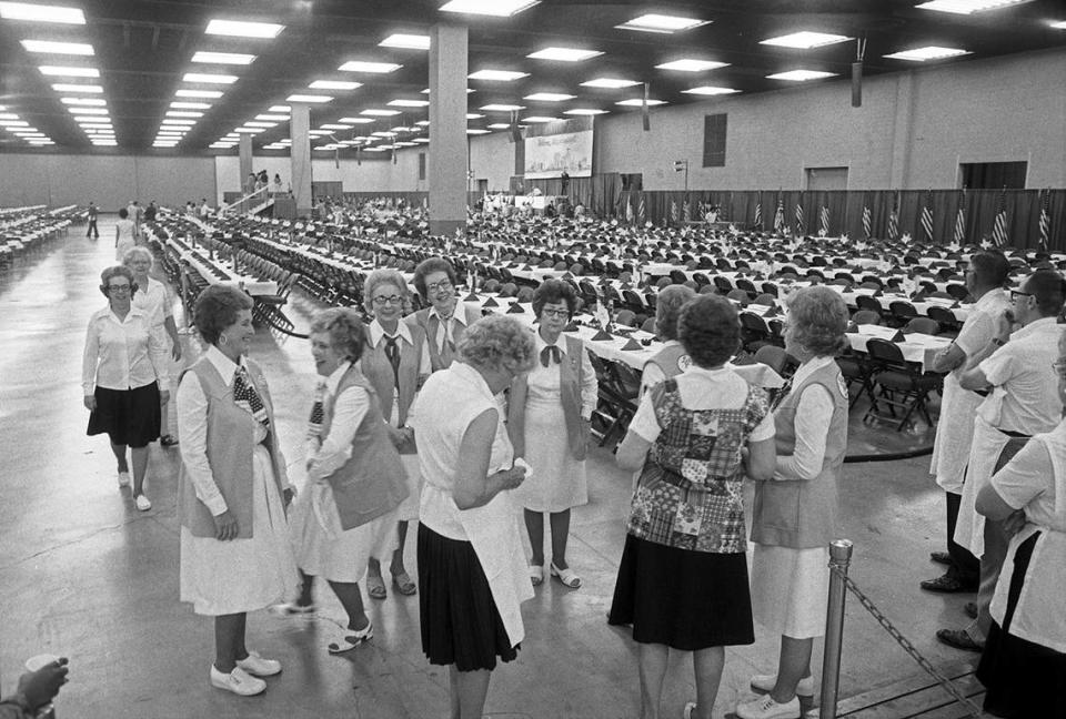 Hostesses swapped stories and jokes as they wait for President Jimmy Carter to arrive at the Tarrant County Convention Center in downtown Fort Worth. The Exhibits Hall was transformed into a giant dining room, suitable for 5,000 persons for the visit on June 23, 1978.