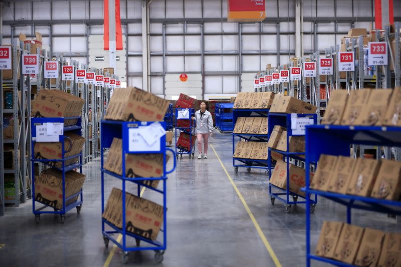 FILE PHOTO: An employee works at a Tmall logistic centre in Suzhou