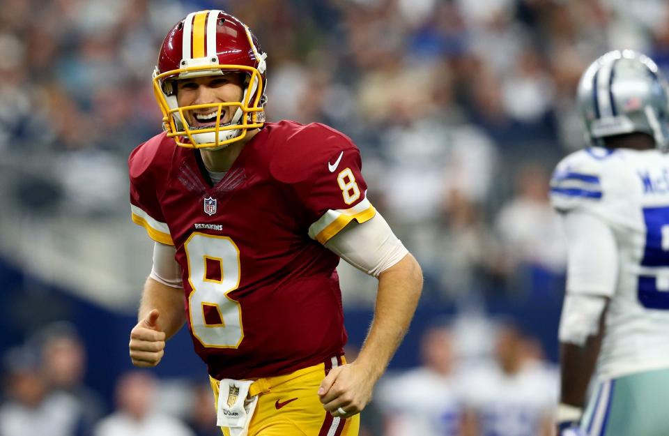 ARLINGTON, TX - JANUARY 03: Kirk Cousins #8 of the Washington Redskins reacts after throwing a touchdown pass against the Dallas Cowboys during the first quarter at AT&T Stadium on January 3, 2016 in Arlington, Texas. (Photo by Ronald Martinez/Getty Images)