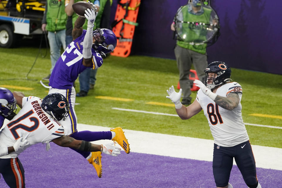 Minnesota Vikings cornerback Cameron Dantzler (27) intercepts a pass intended for Chicago Bears tight end J.P. Holtz (81) during the second half of an NFL football game, Sunday, Dec. 20, 2020, in Minneapolis. (AP Photo/Jim Mone)