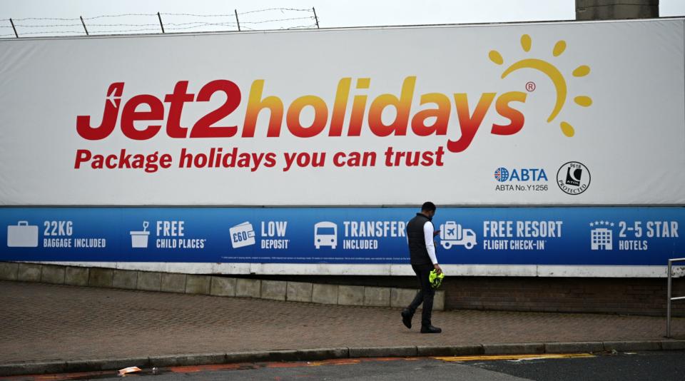 An advert for the Jet2 holidays is pictured near Leeds Bradford airport on August 16, 2020. - The British Airline Pilots Association (Balpa) union said on saturday that Leeds-based carrier was to press ahead with its plan to cut 102 pilot jobs after flights were grounded due to the novel coronavirus pandemic. (Photo by Oli SCARFF / AFP) (Photo by OLI SCARFF/AFP via Getty Images)