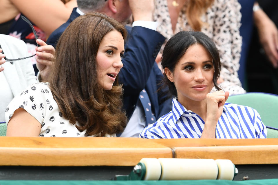 Catherine, Duchess of Cambridge and Meghan, Duchess of Sussex attend day twelve of the Wimbledon Lawn Tennis Championships at All England Lawn Tennis and Croquet Club on July 14 in London, England.