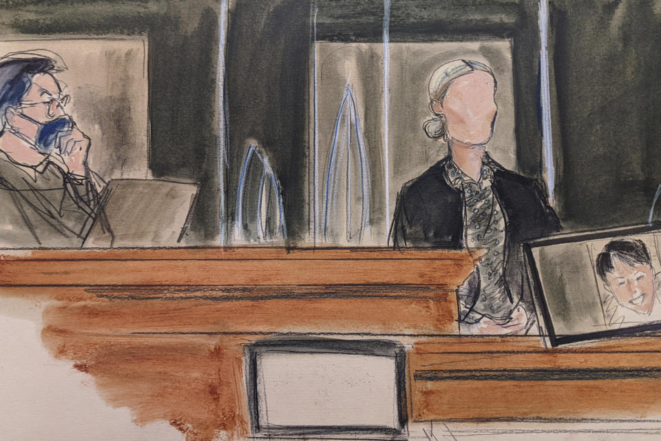 In this sketch, a witness testifies under the pseudonym "Kate," as Judge Alison Nathan seated far left, listens. A photo of Ghislaine Maxwell is shown on the screen, far right, during testimony in the sex-abuse trial of Maxwell, Monday, Dec. 6, 2021, in New York. Maxwell 's family have written to Attorney General Merrick B. Garland requesting that authorities stop using four-point restraints to shackle her hands, waist and feet when she is moved from a holding cell to the courtroom, and that she receive a food pack and a bar of soap each day. (Elizabeth Williams via AP)