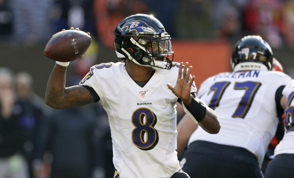 Baltimore Ravens quarterback Lamar Jackson looks to throw against the Cleveland Browns during the first half of an NFL football game, Sunday, Dec. 22, 2019, in Cleveland. (AP Photo/Ron Schwane)