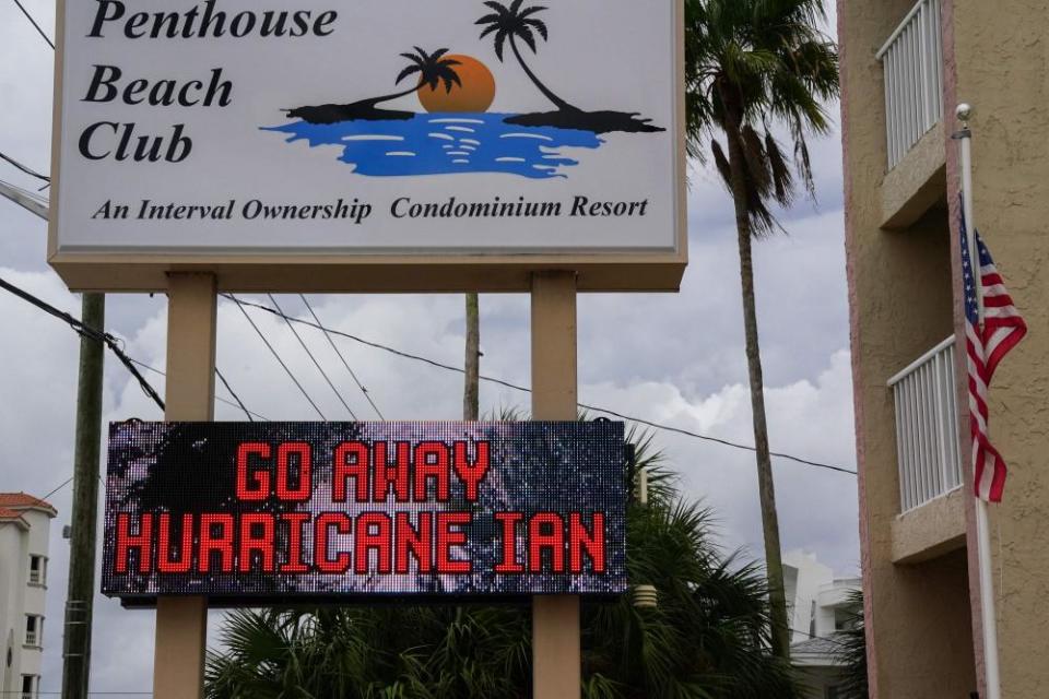 The message “Go Away Hurricane Ian” is displayed on a sign in St Petersburg.