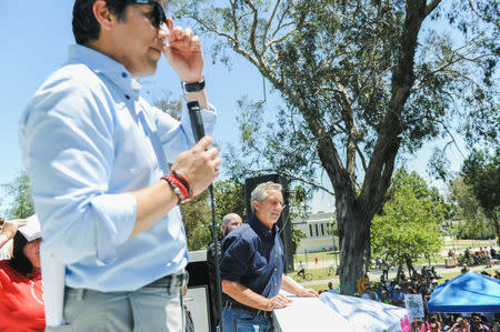California senate president pro tem Kevin de Leon, (L), and environmental activist Robert F. Kennedy Jr. look out at the crowd during the People's Climate March protest for the environment in the Wilmington neighborhood in Los Angeles, California, U.S. April 29, 2017. REUTERS/Andrew Cullen