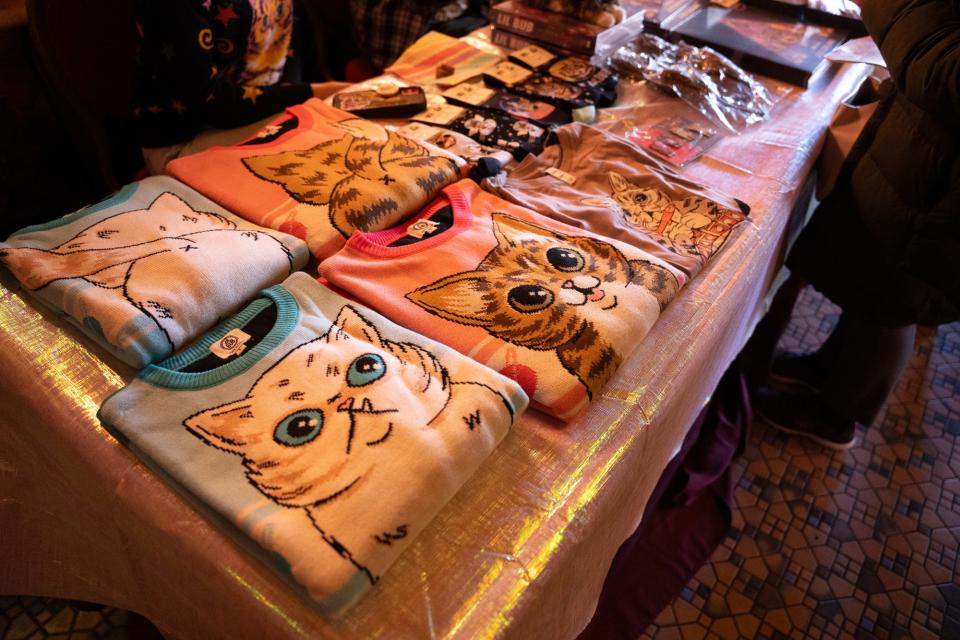 Merchandise of Mr. Marbles and Lil Bub line the table at Remembering Lil Bub at Buskirk-Chumley Theater on Saturday, Feb. 3, 2024.