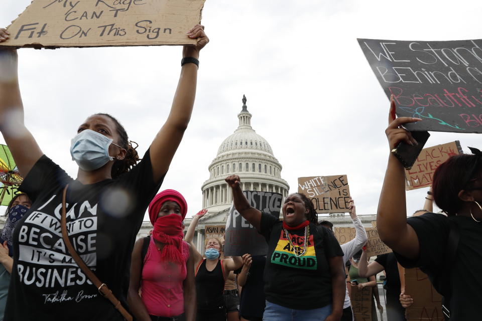 Dominique Bryant, 23, wearing the "Black and Proud" T-shirt, joins others protesting the death of Floyd on June 3 outside the U.S. Capitol in Washington. (Photo: AP Photo/Jacquelyn Martin)