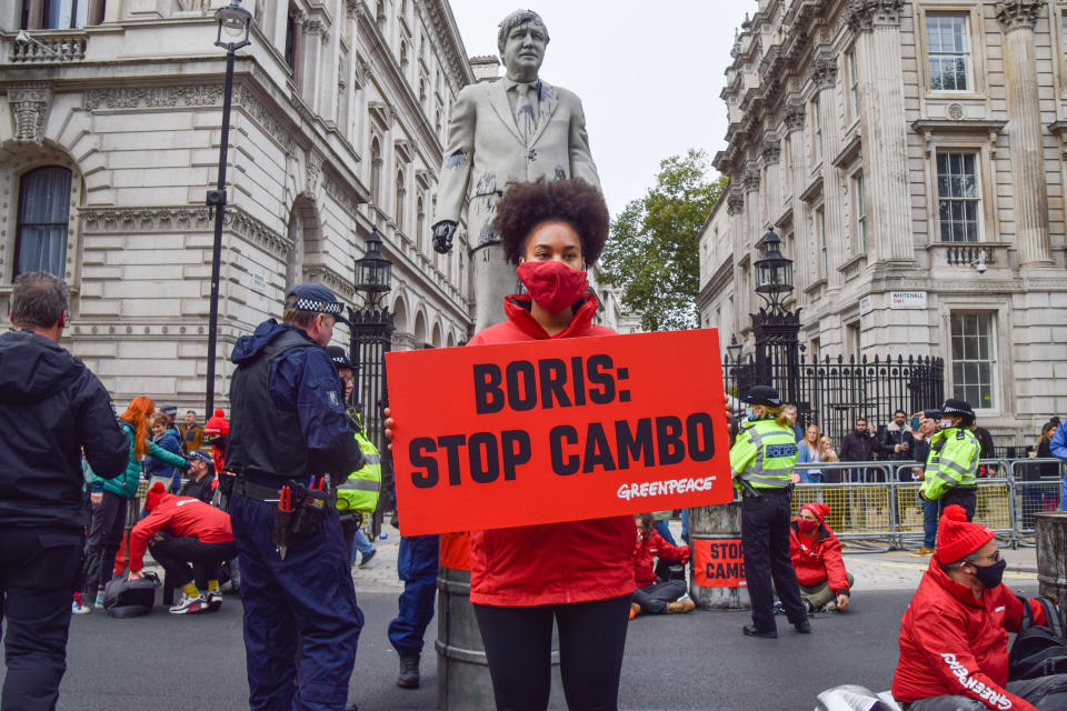 An activist holds a 'Boris: Stop Cambo' placard during the Stop Cambo protest against Shell in December.