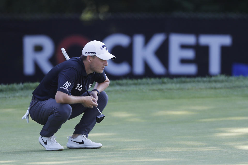 Emiliano Grillo lines up his putt on the ninth green during the first round of the Rocket Mortgage Classic golf tournament, Thursday, July 2, 2020, at the Detroit Golf Club in Detroit. (AP Photo/Carlos Osorio)