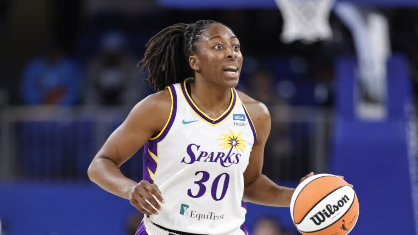 Los Angeles Sparks forward Nneka Ogwumike brings the ball up court against the Chicago Sky.