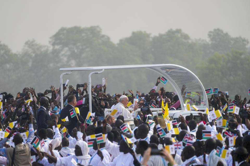 Pope Francis arrives to celebrate mass at the John Garang Mausoleum in Juba, South Sudan, Sunday, Feb. 5, 2023. Francis is in South Sudan on the second leg of a six-day trip that started in Congo, hoping to bring comfort and encouragement to two countries that have been riven by poverty, conflicts and what he calls a "colonialist mentality" that has exploited Africa for centuries. (AP Photo/Gregorio Borgia)