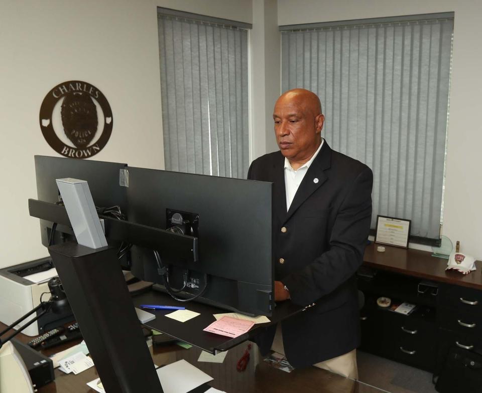 Charles A. Brown, Akron deputy mayor of public safety, works in his office.