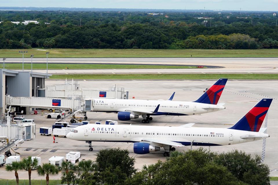 A Delta Air Lines Boeing 757 pushes back from the gate at the Tampa International Airport, Tuesday, Sept. 27, 2022, in Tampa, Fla.