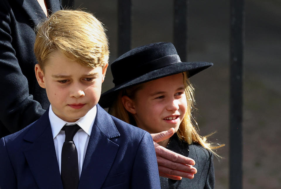 Britain's Prince George and Princess Charlotte walk after a service at Westminster Abbey on the day of the state funeral and burial of Britain's Queen Elizabeth, in London, Britain, September 19, 2022.  REUTERS/Hannah McKay/Pool