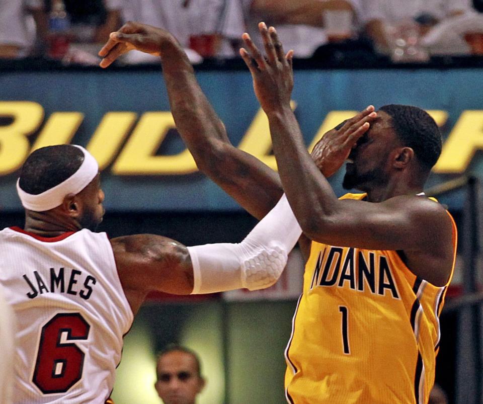 LeBron James slaps Lance Stephenson in the face during the 2014 Eastern Conference Finals. (Charles Trainor Jr./Miami Herald/MCT/Getty Images)