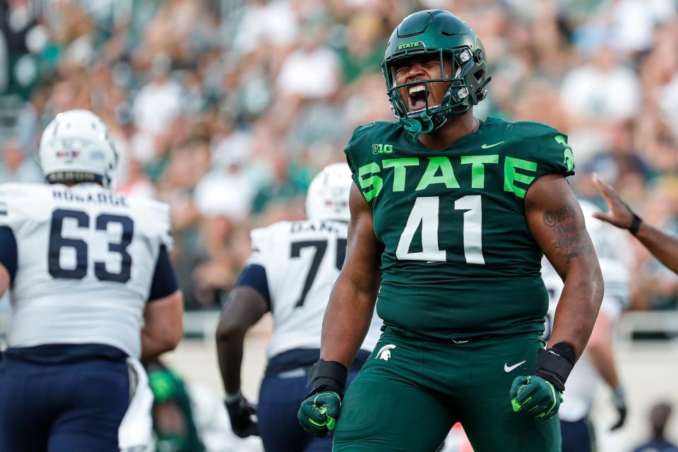 Michigan State defensive tackle Derrick Harmon (41) celebrates after sacking Akron quarterback Jeff Undercuffler Jr. (13) during the second half at Spartan Stadium in East Lansing on Saturday, Sept. 10, 2022.