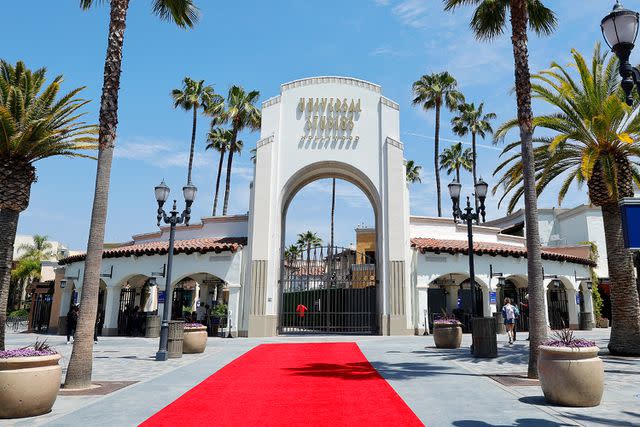 <p>Amy Sussman/Getty </p> The entrance to Universal Studios Hollywood