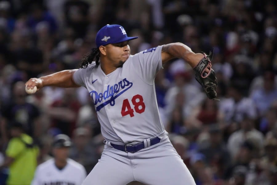 Los Angeles Dodgers relief pitcher <span class="caas-xray-inline-tooltip"><span class="caas-xray-inline caas-xray-entity caas-xray-pill rapid-nonanchor-lt" data-entity-id="Brusdar_Graterol" data-ylk="cid:Brusdar_Graterol;pos:4;elmt:wiki;sec:pill-inline-entity;elm:pill-inline-text;itc:1;cat:Athlete;" tabindex="0" aria-haspopup="dialog"><a href="https://search.yahoo.com/search?p=Brusdar%20Graterol" data-i13n="cid:Brusdar_Graterol;pos:4;elmt:wiki;sec:pill-inline-entity;elm:pill-inline-text;itc:1;cat:Athlete;" tabindex="-1" data-ylk="slk:Brusdar Graterol;cid:Brusdar_Graterol;pos:4;elmt:wiki;sec:pill-inline-entity;elm:pill-inline-text;itc:1;cat:Athlete;" class="link ">Brusdar Graterol</a></span></span> works against an Arizona Diamondbacks batter during the seventh inning in Game 3 of a baseball NL Division Series, Wednesday, Oct. 11, 2023, in Phoenix. (AP Photo/Rick Scuteri)